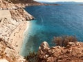 Rustic rocks form a natural wall around KaputaÃÅ¸ Beach in Turkey